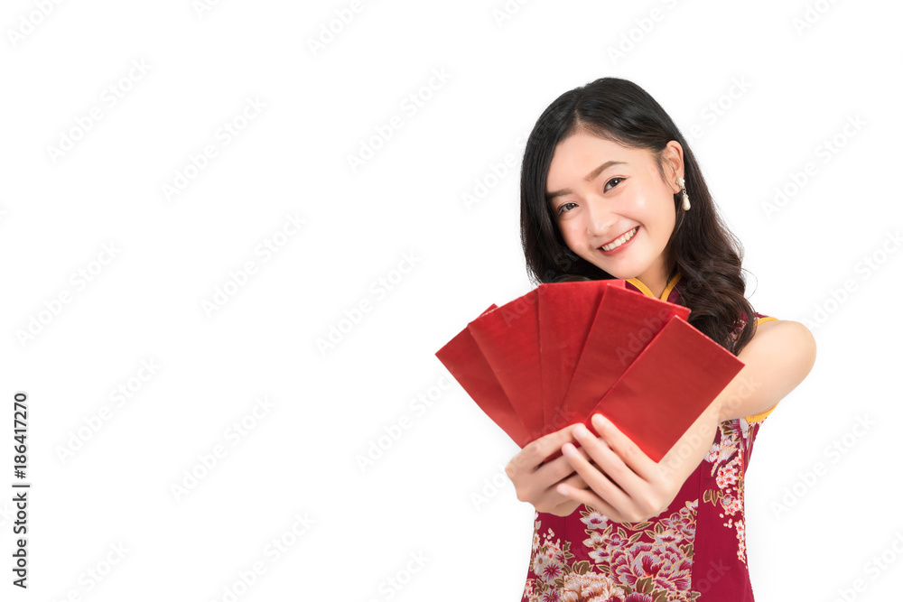 Asian woman wearing chinese dress hold Red envelopes or cheongsam,qipao smile in chinese new year on white isolated background Asian woman wearing chinese dress hold Red envelopes or cheongsam,qipao smile in chinese new year on white isolated background