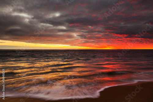 A sunset over looking the water at Port Noarlunga Beach