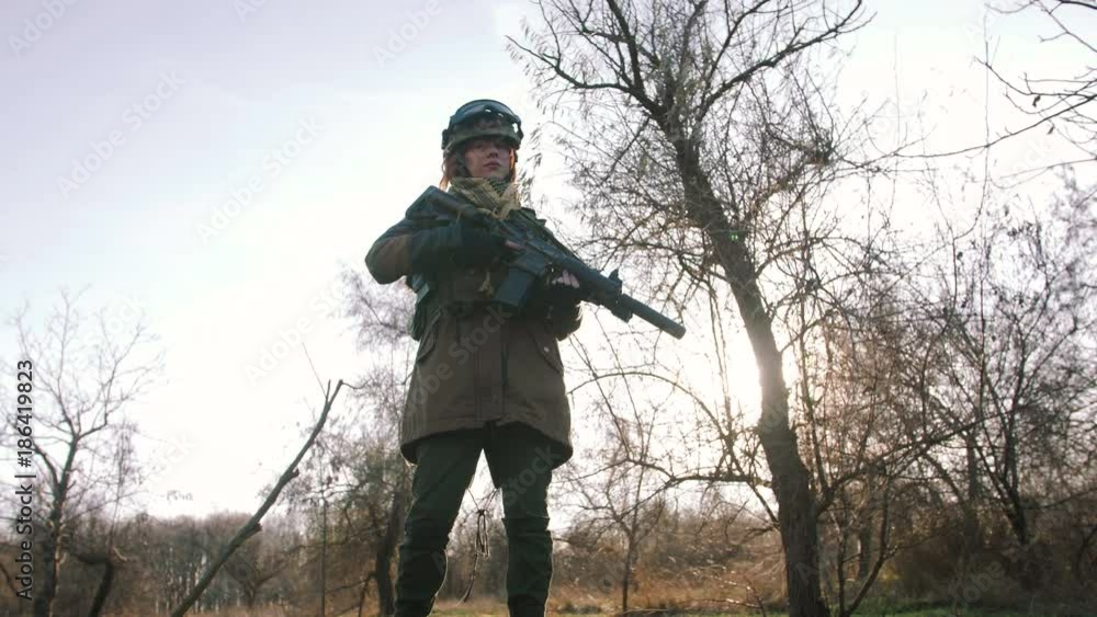 custom made wallpaper toronto digitalYoung pretty redhead woman in military uniform armed with rifle at the battlefield area