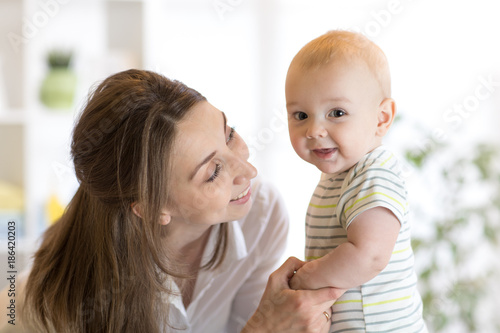 Happy child near to mom in ...