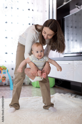 Mother and baby doing yoga