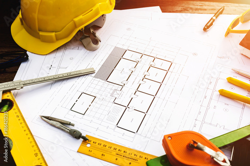 Canvas Print A desk of contractor engineers who are going to build a low cost home and save e