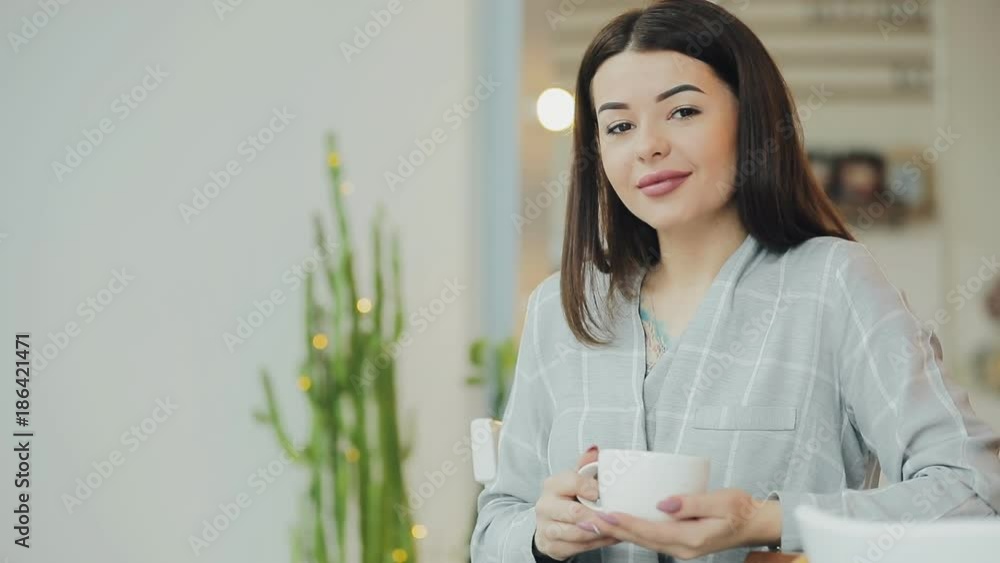 Young woman enjoy to drink coffee in cafe Young woman enjoy to drink coffee in cafe