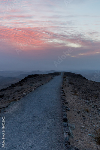 Vertical photo road to beautiful infifnite sunrise over holy land in Israe photo