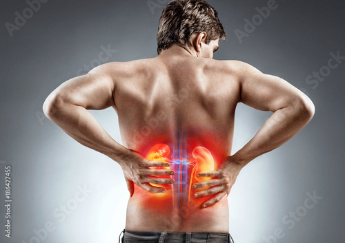 Kidneys pain. Man holding his back. Medical concept. photo