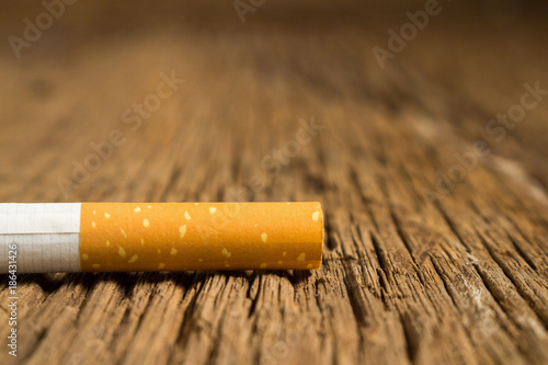 Tobacco cigarette on a wooden