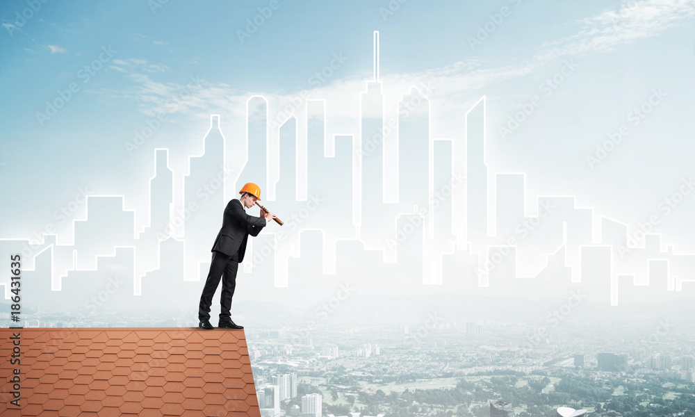 Engineer man standing on roof and looking in spyglass. Mixed media Engineer man standing on roof and looking in spyglass. Mixed media