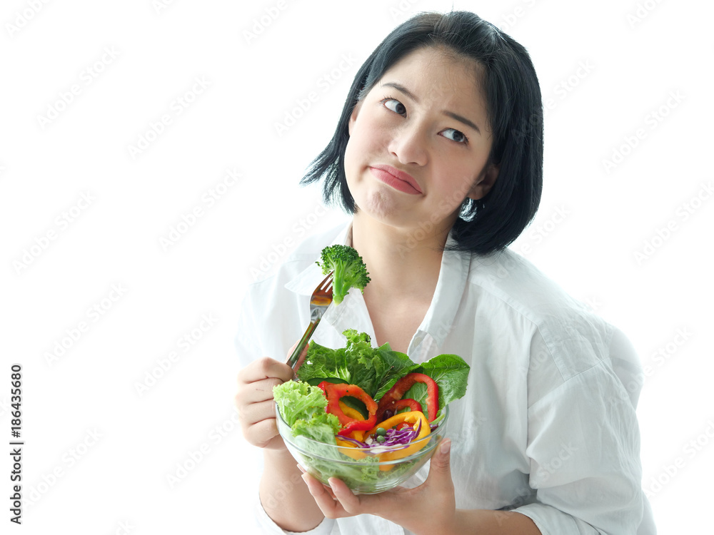 Asian woman hating salad vegetable diet food Asian woman hating salad vegetable diet food