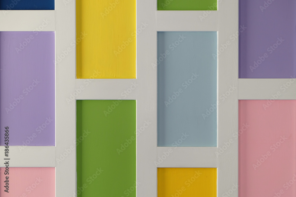 Wall or background of multi square pastel colors with white frame