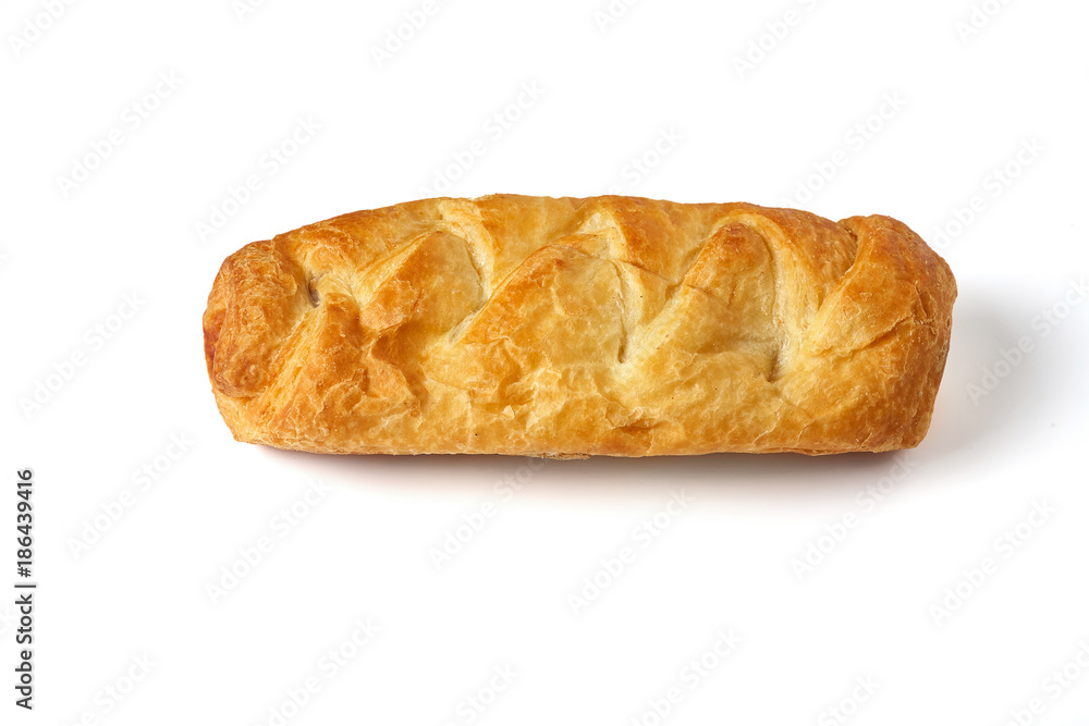 Baked bun on a white background close-up. Isolate. Baked bun on a white background close-up. Isolate.