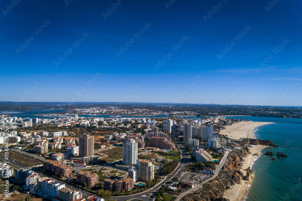 Aerial view of the coastline in Rocha Beach (Praia da Rocha) in Portimao, Algarve, Portugal; Concept for travel in Portugal and Algarve