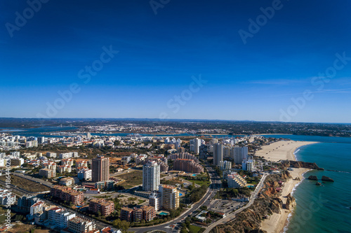 Aerial view of the coastline in Rocha Beach (Praia da Rocha) in Portimao, Algarve, Portugal; Concept for travel in Portugal and Algarve