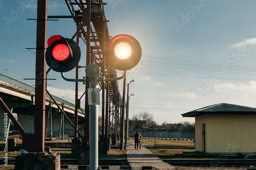 Railroad crossing, flashing traffic light. photo