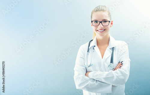 Young doctor woman smile face with stethoscope and white coat