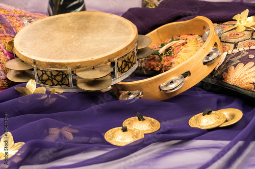 musical instruments of a bellydance percussiongroup with darbuka's, tambourines and zills photo