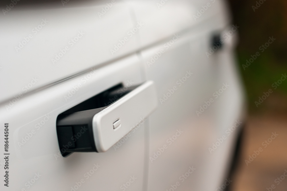 Fototapeta premium Door handle in the new car