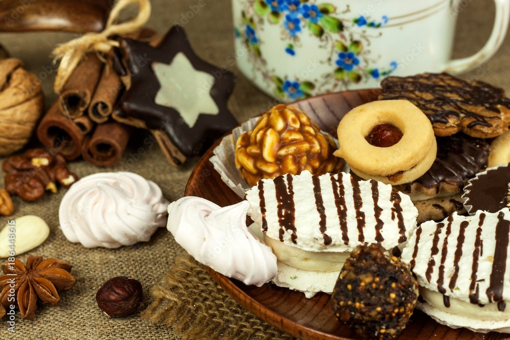 Home cookies on a dining table. Unhealthy sweet food. Dangers of obesity and diabetes. Home cookies on a dining table. Unhealthy sweet food. Dangers of obesity and diabetes.