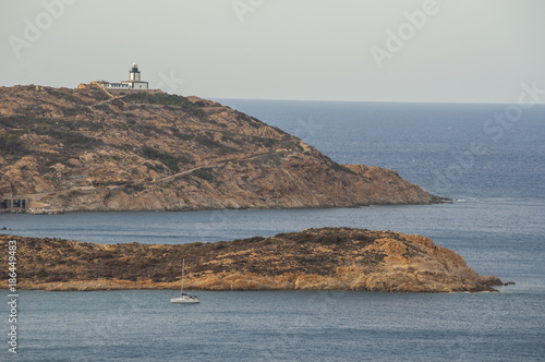 Corsica, 03/09/2017: Punta di Revellata, il promontorio lungo la costa nord occidentale dell'isola, a ovest della città di Calvi, con vista del faro di Revellata, faro marittimo inaugurato nel 1844 photo