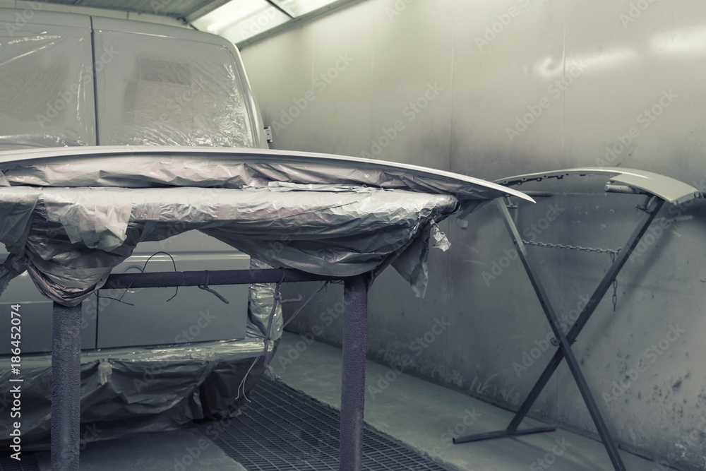 Car ready to repair paint a part in the paint cabin. Car ready to repair paint a part in the paint cabin.