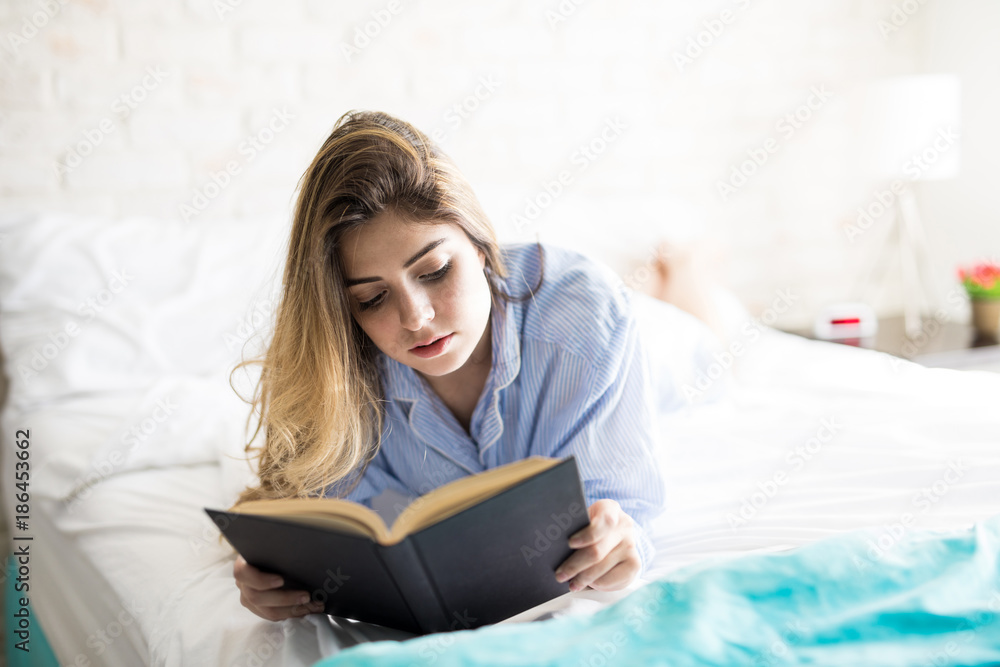 Cute girl reading in the morning Cute girl reading in the morning