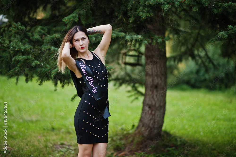 Portrait of gorgeous girl wear on black at hen party, posed at park. Portrait of gorgeous girl wear on black at hen party, posed at park.