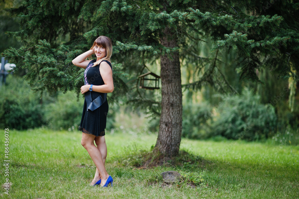 Portrait of gorgeous girl wear on black at hen party, posed at park. Portrait of gorgeous girl wear on black at hen party, posed at park.