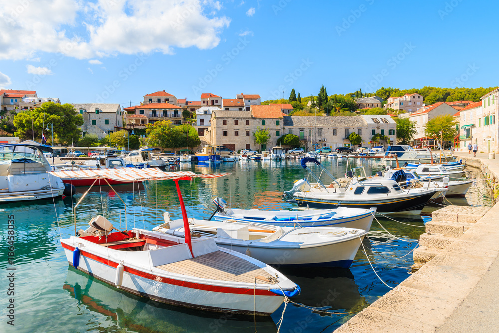 Colorful typical fishing boats anchoring in Sumartin port on Brac island, Croatia