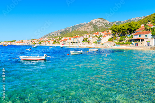 Turquoise sea and colorful fishing boats in Bol port, Brac island, Croatia