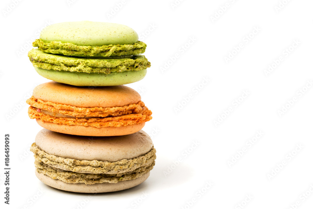 Three macaroons multicolored on a white background. Three macaroons multicolored on a white background.
