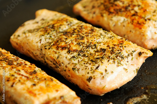 Fresh Alaskan salmon steak on a grill plate