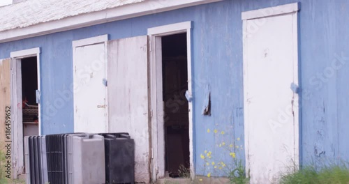 Blue shacks with open doors photo