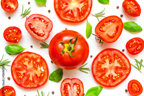 fresh tomatoes, herbs and spices on white background
