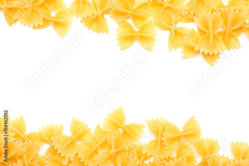 Raw farfalle top view isolated on white background hollow in the centre dry pasta pieces.