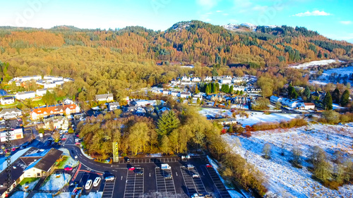 Low level aerial footage of the village of Aberfoyle in Scotland. photo
