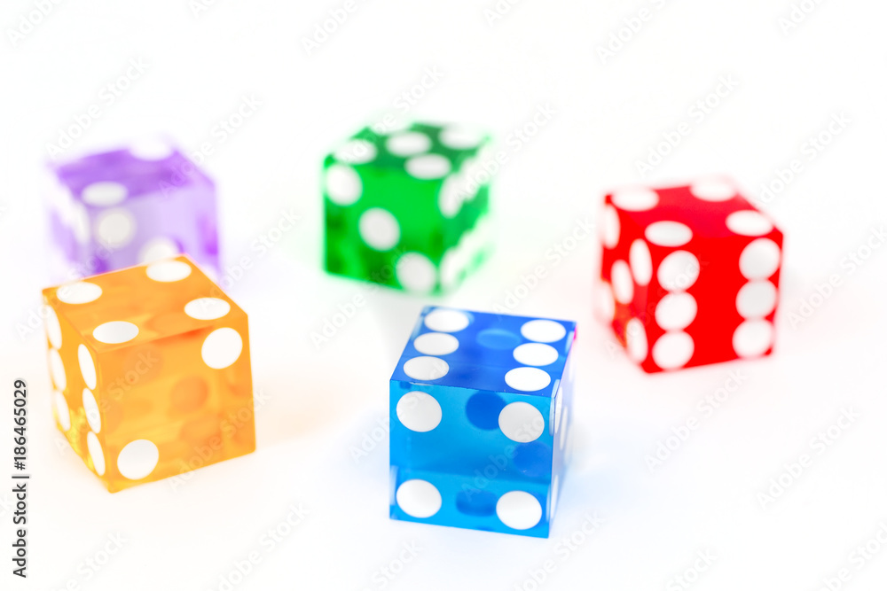 five color dice over white