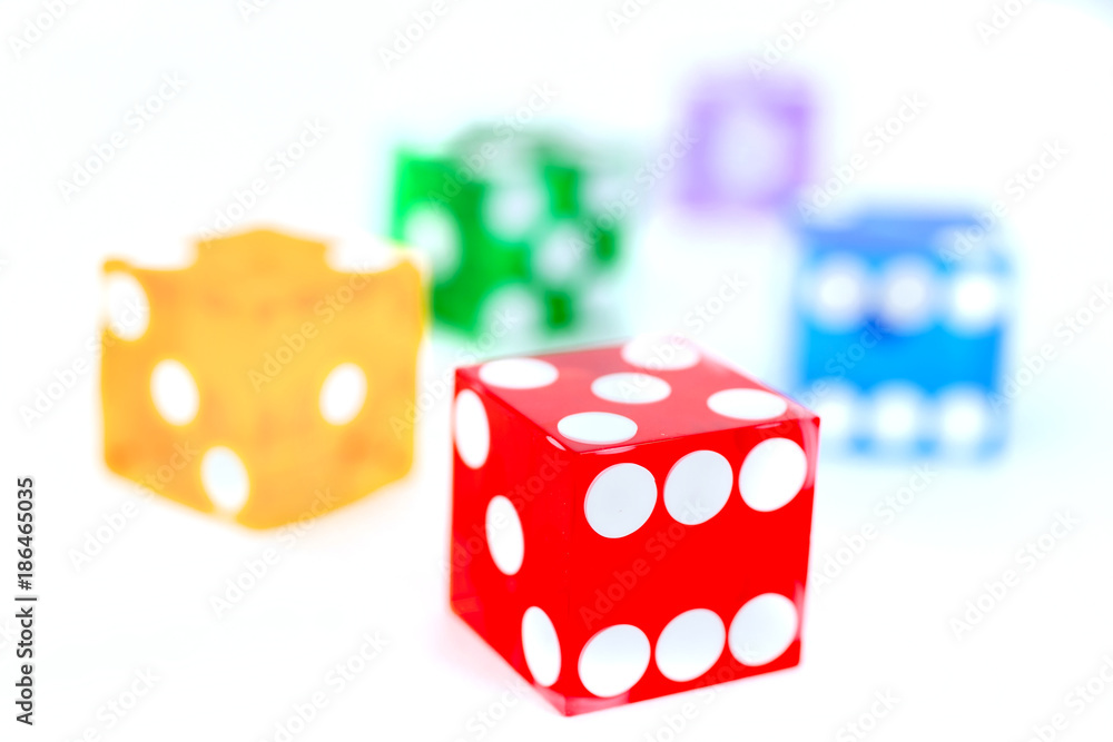 five color dice over white five color dice over white