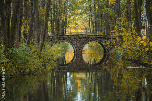 Beautiful scenery in Belarus. Magnificent autumn in the European city. A beautiful bridge across the river autumn.