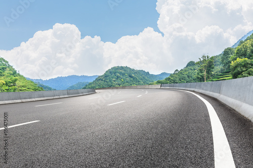 country road and mountains natural landscape in the summer