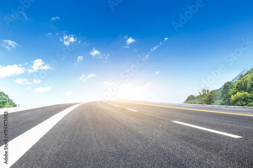 country road and mountains natural landscape in the summer