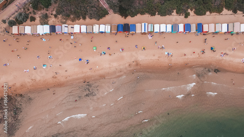 Birds eye aerial view of beach houses with people