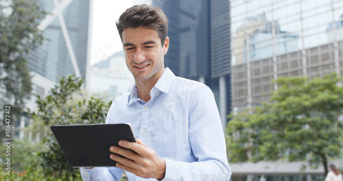 Canvas Print Caucasian business man use of tablet at outdoor