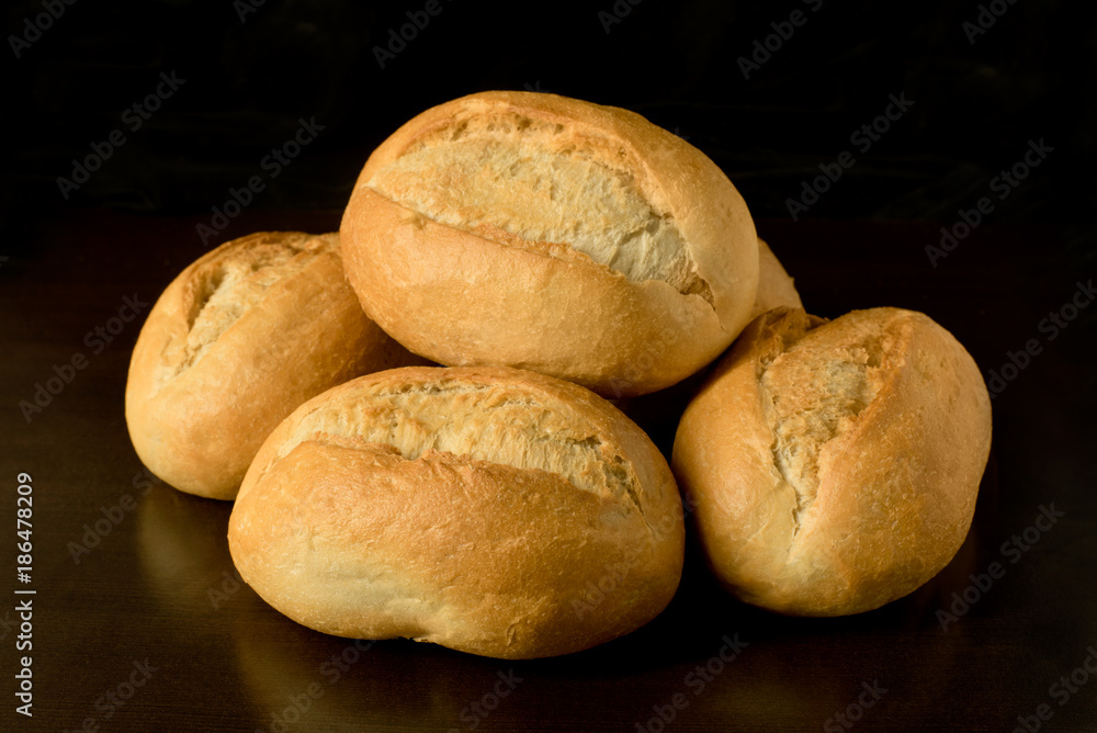 Small bread rolls, brötchen - breakfast rolls - on dark background