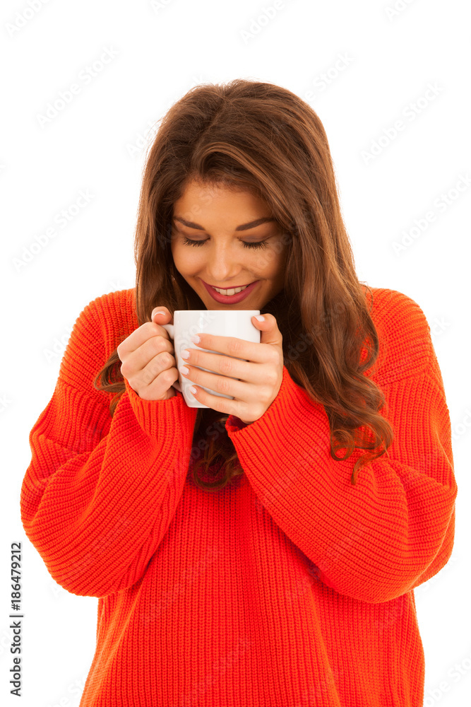 Beautiful young woman drinks coffee isolated over white background - cup of tea