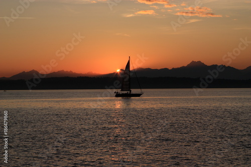 A sailboat on Puget Sound at sunset © Shutterbug Fotos