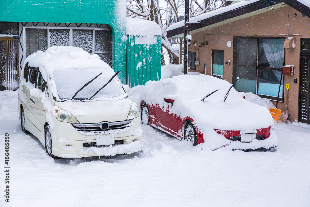 Cars covered with lots of snow during winter in Hokkaido, Japan Cars covered with lots of snow during winter in Hokkaido, Japan