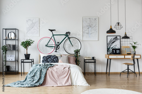 Bicycle and cushion in bedroom