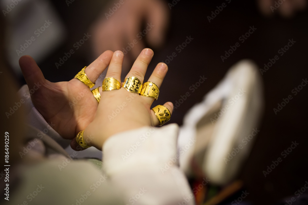 Dierbare Ten einde raad schraper The first birthday party of Korean tradition. gold ring for a baby. Stock  Photo | Adobe Stock