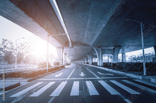 Highway Junction Flyover Ramps New Highway road junction inter section flyover ramps structures complete for vehicle traffic flow. photo