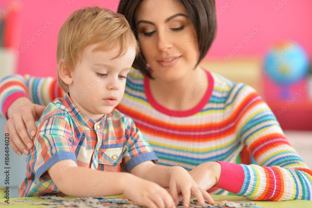 Young mother playing with son