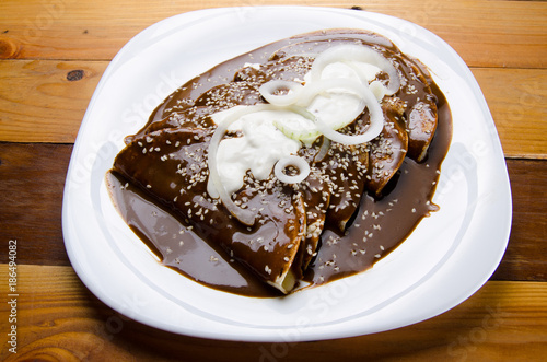 Mexican food: Enchiladas with mole sauce photo